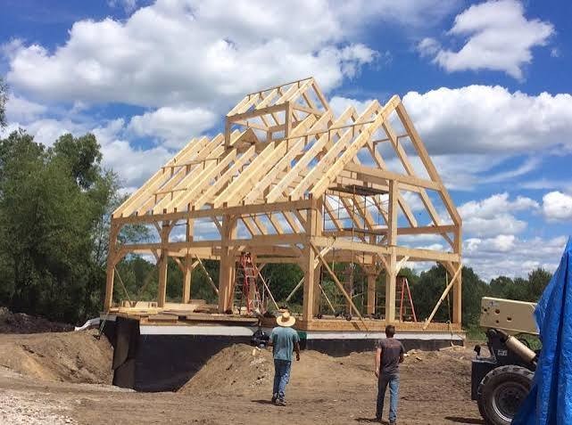 Timber frame with a monitor roof set on a concrete foundation