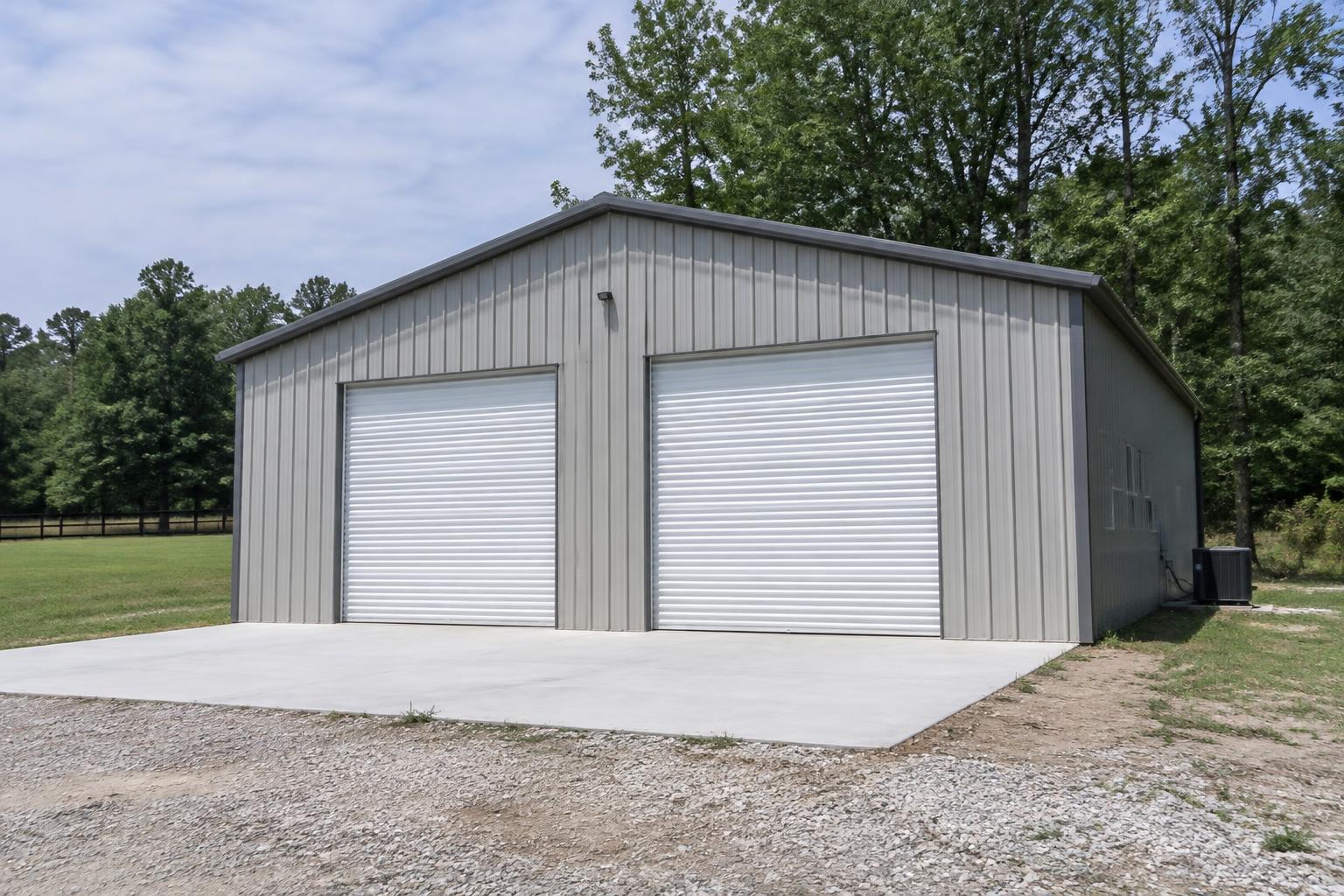 Gray metal workshop with two roll-up doors
